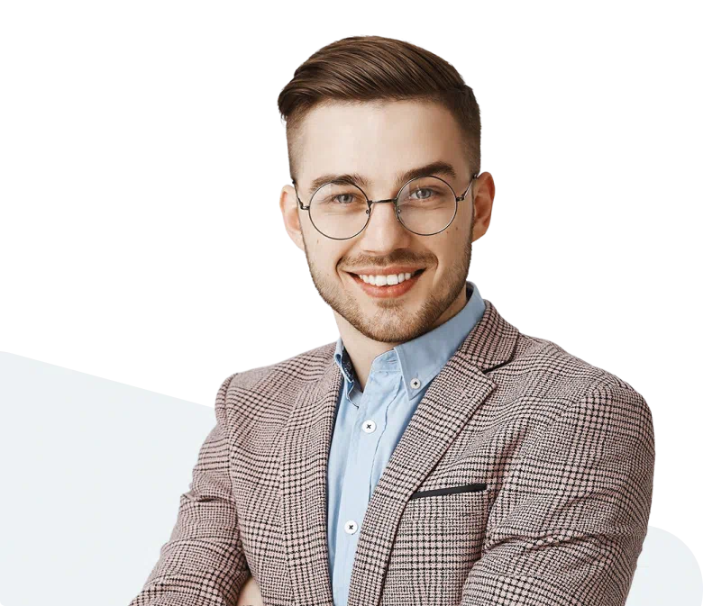 A well-dressed man smiling at the camera